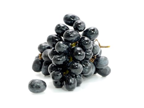 Black grapes isolated on white background.