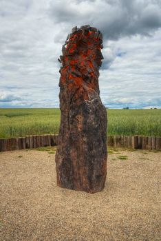 Menhir Stone Shepherd (also Stone Man, Petrified Man or Petrified minister) is a menhir standing alone in a field 1 km northwest of the village Klobuky, district Kladno. This is the highest menhir in the Czech Republic.  3.5 m tall columnar rock uncut dark iron Cretaceous sandstone. This is one of the few stones in the country, which we can with high probability be considered a real prehistoric menhir.