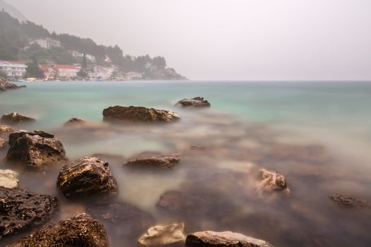Heavy Rainstorm and Fog on Rocky Beach near Omis, Dalmatia, Croatia