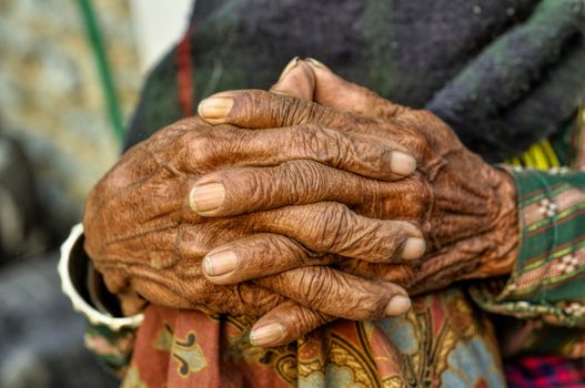 Wrinkled hands of an old woman in Nepal