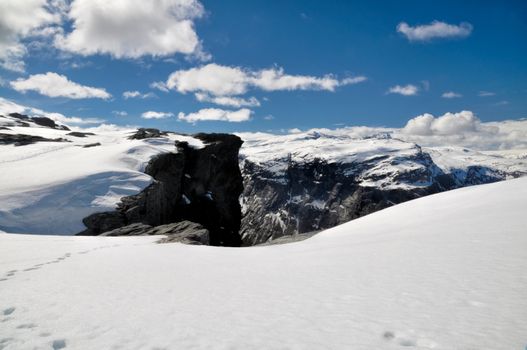 Scenic view of the gorge between snow-covered mountains in Norway