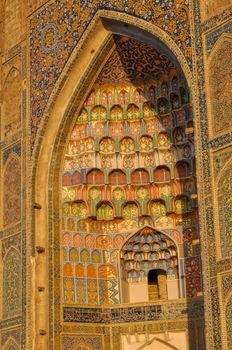 Picturesque view of the intricate pattern on the wall of Abdulaziz Khan Madrassah (Museum of Wood Carving Art), Uzbekistan