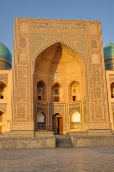 Picturesque view of the entrance to Abdulaziz Khan Madrassah (Museum of Wood Carving Art), Uzbekistan