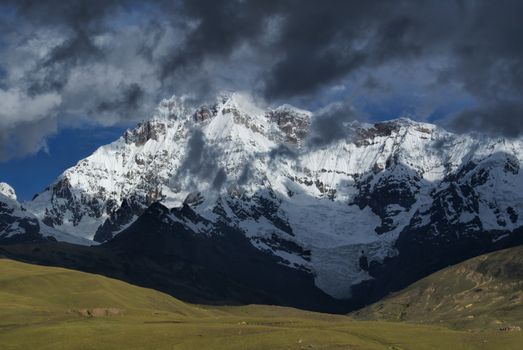 Close-up view of the sunlit peaks of the Ausangate mountain in Peru                                    
