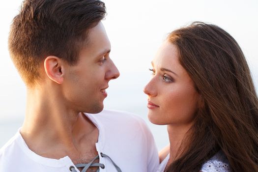 Summer, sea. Cute, lovely couple on the beach