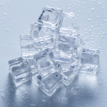 Cold. Frozen ice cubes on the table