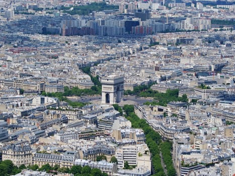 Photo is showing various views onto Paris, France with its many houses and roofs.