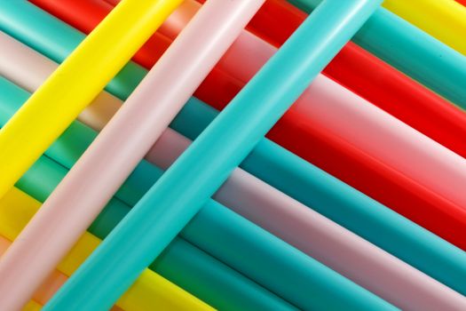 Photo presents details of colourful plastic straws patterns.