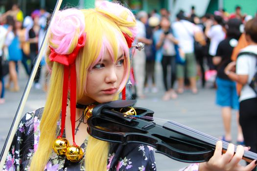 Bangkok - Aug 31: An unidentified Japanese anime cosplay pose  on August 31, 2014 at Central World, Bangkok, Thailand.