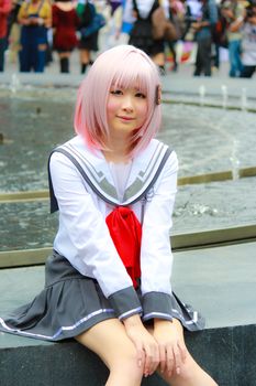 Bangkok - Aug 31: An unidentified Japanese anime cosplay pose  on August 31, 2014 at Central World, Bangkok, Thailand.