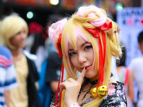 Bangkok - Aug 31: An unidentified Japanese anime cosplay pose  on August 31, 2014 at Central World, Bangkok, Thailand.