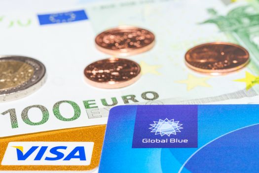MUNICH, GERMANY - FEBRUARY 23, 2014: "Global Blue", "Visa" credit card and cash money - your way for tax free shopping.