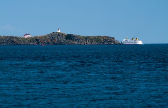 Ferry departing around Lighthouse 