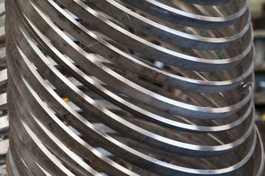 Rings of stainless steel at an industrial workshop.