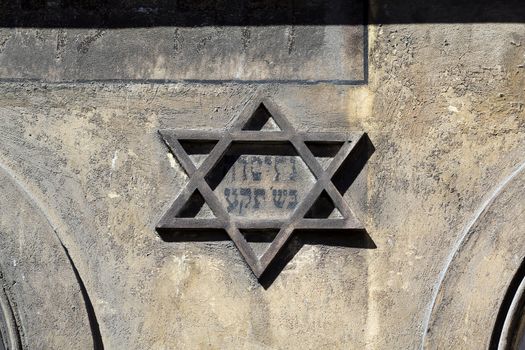 symbol of jewish star of david on the front on old building in kazimierz-district of krakow in poland