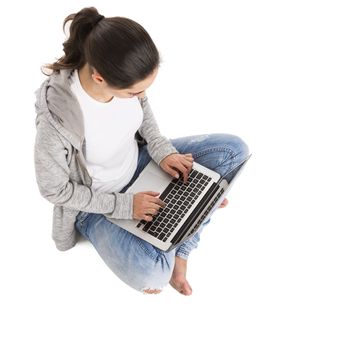 BTop view of a beautiful woman sitting and working with a laptop