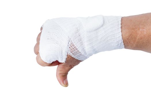 Thumb down showing by hand with white bandages isolated on white background