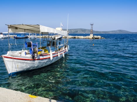Wooden Greek fishing boats in the sea and against clear blue sky, Alonissos, Greek Islands, Greece