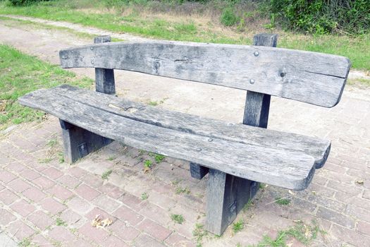 massive weathered wooden bench 