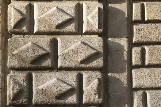 old building wall fragment with rhombic pattern in Barcelona