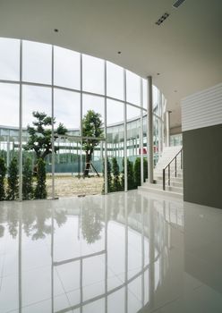Glass wall of courtyard in the modern building 