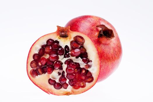 sectioned pomegranate isolated on white background
