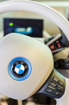 MUNICH, GERMANY - AUGUST 8, 2014: White design interior of environmentally friendly full-time electric car BMW i3. Vertical close-up photo with small DOF.