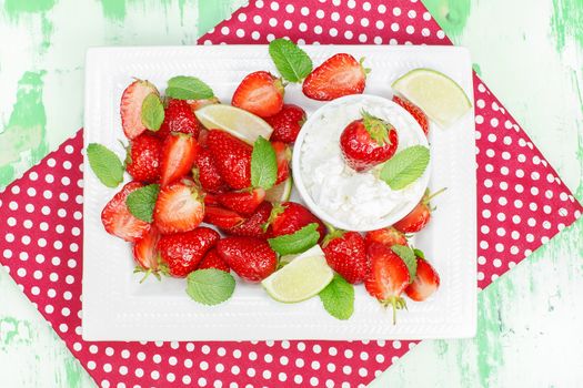 Macerated strawberries with mascarpone whipped cream and mint