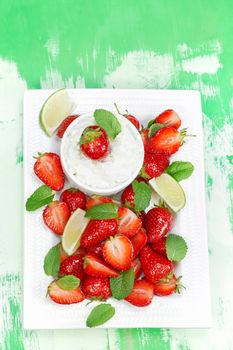 Macerated strawberries with mascarpone whipped cream and mint