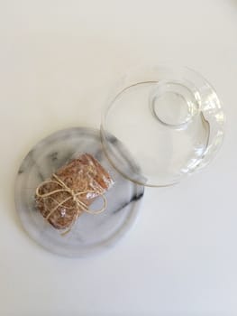 Individually wrapped bread under a cake bell