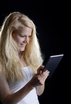  laughing young woman with digital tablet