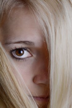 young blond woman with beautiful eye