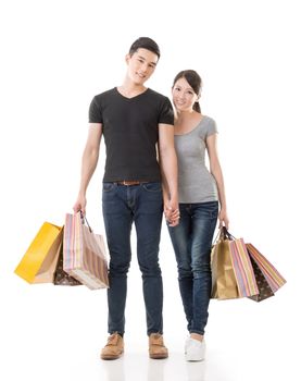 Asian couple shopping, full length portrait isolated on white background.