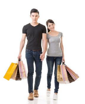 Asian couple shopping, full length portrait isolated on white background.