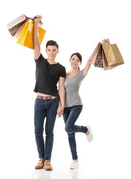 Asian couple shopping, full length portrait isolated on white background.