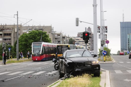 SERBIA, BELGRADE - MAY 12, 2013: Damaged black car after accident with tram. The car did not give priority to tram