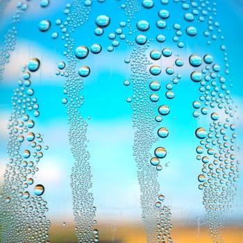 Drops of water on the crooked glass, shallow dof