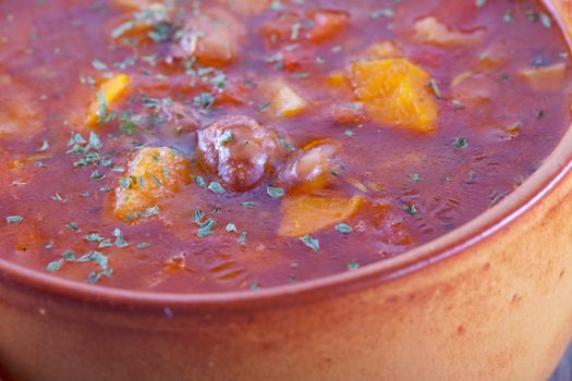 Soup with beans in crock pot, close up