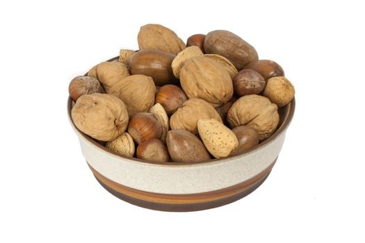 A Bowl Of A Variety Of Nuts Isolated On A White Background