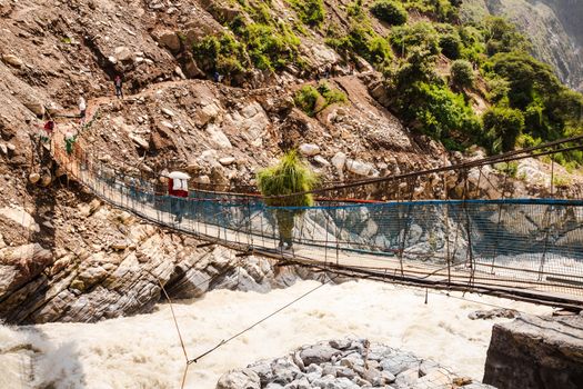 Crossing the suspension bridge in india