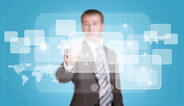 Businessman in suit finger presses virtual button. Transparent rectangles, world map, network as backdrop