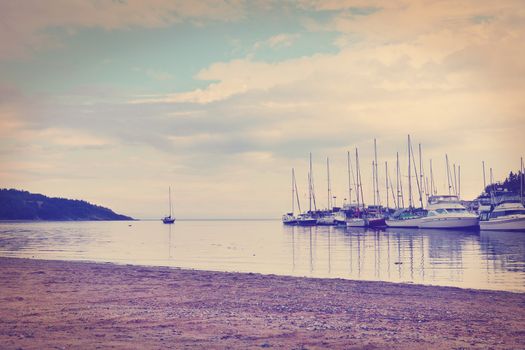 Sailboats in the harbor and beautiful beach- color filters effect