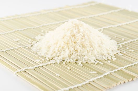 uncook rice on wooden pad