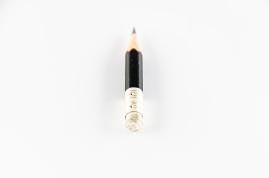 short black pencil on a white background