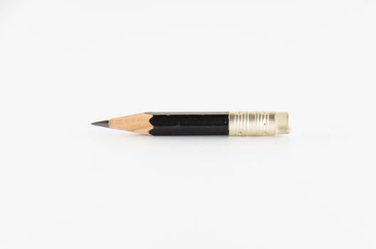short black pencil on a white background