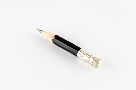 short black pencil on a white background