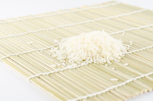 uncook rice on wooden pad