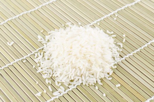 uncook rice on wooden pad