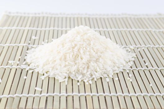 uncook rice on wooden pad