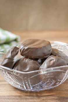 Peppermint patties filled with white, yellow, and orange colored filling.